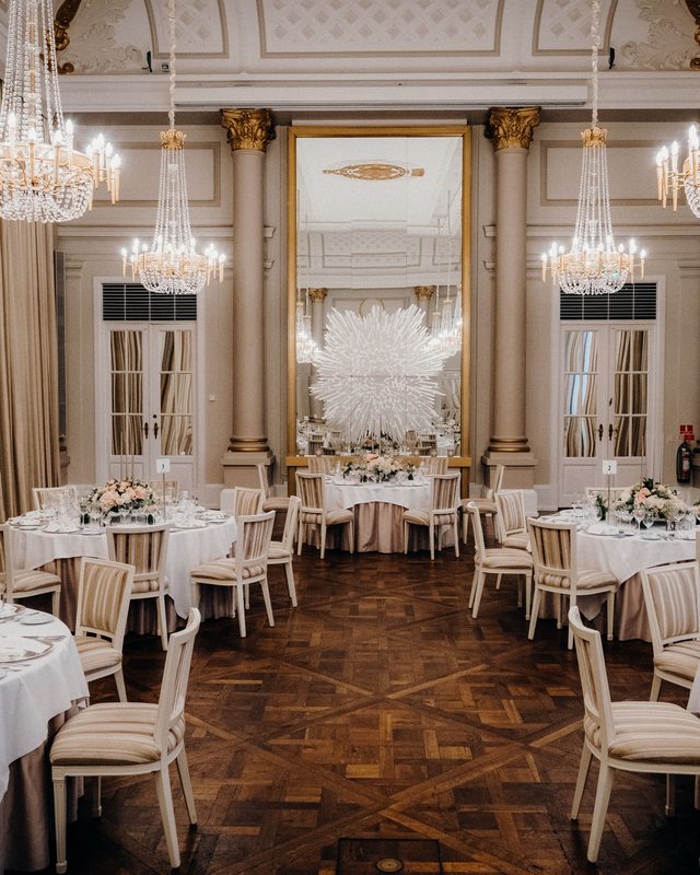 Ballroom with crystal chandeliers set for a banquet